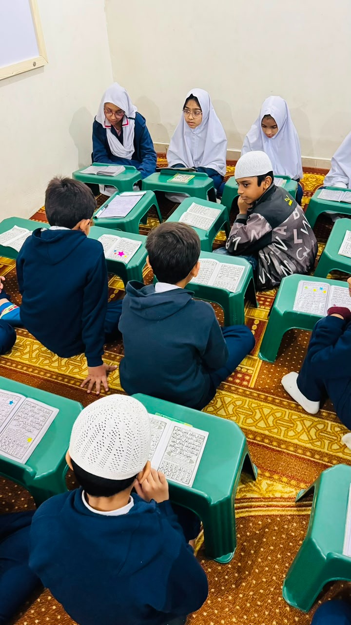 Students studying Quran as part of Islamic Tarbiyah